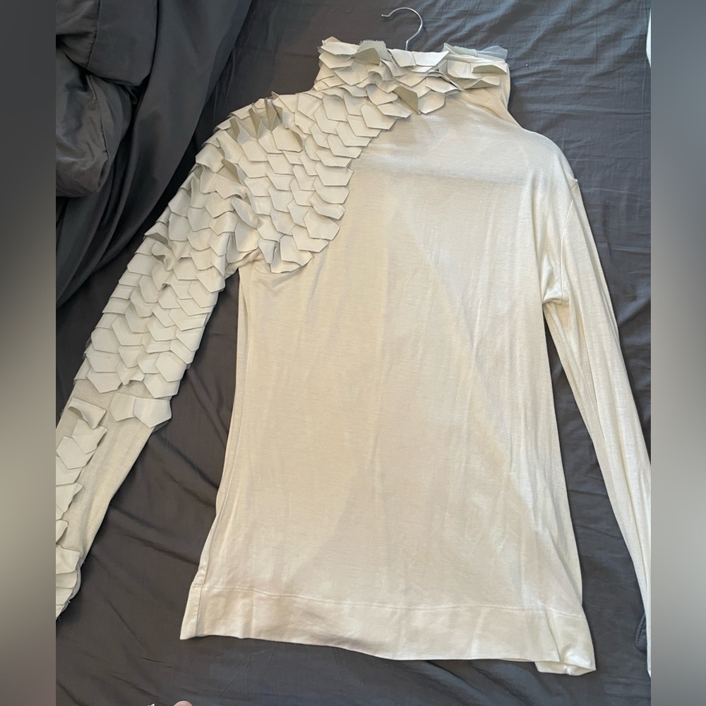 Beautiful cream shirt with dragon scales on one shoulder